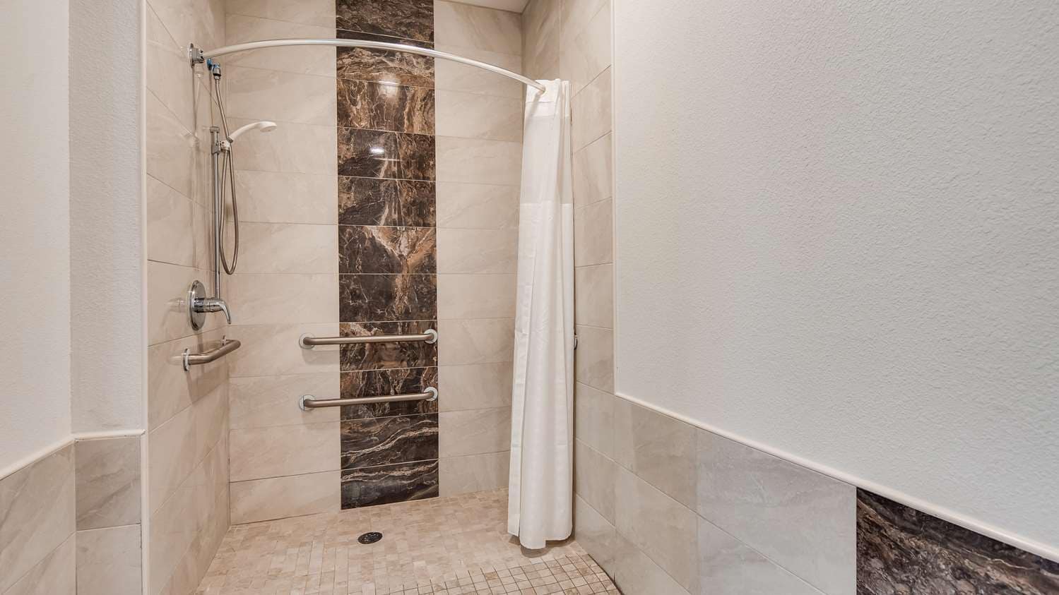 Roll in Shower in our Mobility Accessible Suite Bedrooms